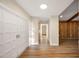 Bright entryway with white double doors and wood flooring at 410 N Tecumseh Ave, Fort Meade, FL 33841