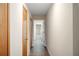 Bright hallway with wood-look flooring and neutral walls at 410 N Tecumseh Ave, Fort Meade, FL 33841