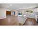 Open concept kitchen with island, stainless steel appliances, and views to the Gathering room at 410 N Tecumseh Ave, Fort Meade, FL 33841