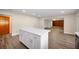 White kitchen island with quartz countertop and modern cabinetry at 410 N Tecumseh Ave, Fort Meade, FL 33841