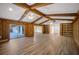 Living room with wood beams, built-in shelving and hardwood floors at 410 N Tecumseh Ave, Fort Meade, FL 33841