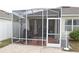 Screened patio and backyard with brick pavers at 433 Montego Bay Dr, Mulberry, FL 33860