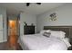 Main bedroom with king-size bed, dresser and view into bathroom at 433 Montego Bay Dr, Mulberry, FL 33860