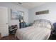 Bedroom with queen-size bed, gray bedding, and ceiling fan at 433 Montego Bay Dr, Mulberry, FL 33860