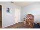 Spacious bedroom with a large dollhouse and wood flooring at 433 Montego Bay Dr, Mulberry, FL 33860