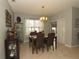 Bright dining room features a table with four chairs and built-in hutch at 433 Montego Bay Dr, Mulberry, FL 33860