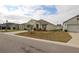 One-story house with attached garage, landscaping, and driveway at 433 Montego Bay Dr, Mulberry, FL 33860