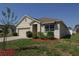 Exterior view of a single-story house showcasing its clean design and well-maintained front lawn at 433 Montego Bay Dr, Mulberry, FL 33860
