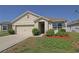 Charming single-story home featuring a well-manicured lawn and neutral color palette at 433 Montego Bay Dr, Mulberry, FL 33860