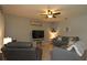 Living room with fireplace and ceiling fan at 433 Montego Bay Dr, Mulberry, FL 33860