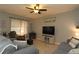 Living room with grey sectional sofa and ceiling fan at 433 Montego Bay Dr, Mulberry, FL 33860