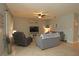 Comfortable living room with grey couches and a large TV at 433 Montego Bay Dr, Mulberry, FL 33860