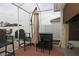 Screened patio area with outdoor furniture and umbrella at 433 Montego Bay Dr, Mulberry, FL 33860