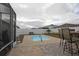 Relaxing pool area with patio furniture and fire pit at 433 Montego Bay Dr, Mulberry, FL 33860