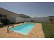 Private backyard pool with a brick patio and white privacy fence at 433 Montego Bay Dr, Mulberry, FL 33860