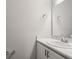 Bathroom featuring a bright white vanity with a marble countertop and a large mirror at 447 Ituna Cir, Winter Haven, FL 33881