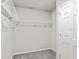 Walk-in closet featuring wire shelving and neutral-toned walls, offering ample storage space at 447 Ituna Cir, Winter Haven, FL 33881