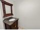 Vanity with granite countertop and wood cabinet at 514 Mohawk Ave, Lakeland, FL 33815