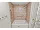 Bathroom with shower/tub and tiled walls at 514 Mohawk Ave, Lakeland, FL 33815