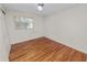 Hardwood floor bedroom with window and closet at 514 Mohawk Ave, Lakeland, FL 33815