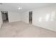 Large bedroom with carpet and access to hallway at 514 Mohawk Ave, Lakeland, FL 33815