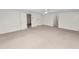Spacious carpeted bedroom with ceiling fan at 514 Mohawk Ave, Lakeland, FL 33815