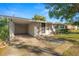 House exterior showcasing carport and landscaping at 514 Mohawk Ave, Lakeland, FL 33815