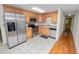 Stainless steel appliances and wood cabinets in kitchen at 514 Mohawk Ave, Lakeland, FL 33815