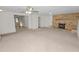 Living room featuring a brick fireplace and carpet at 514 Mohawk Ave, Lakeland, FL 33815