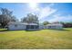 Large backyard with screened patio and detached workshop at 514 Oshea Ct, Auburndale, FL 33823