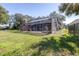 Spacious backyard with screened pool and lush lawn at 5171 Deeson Pointe Ct, Lakeland, FL 33805