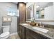 Updated bathroom with double vanity and granite countertops at 5171 Deeson Pointe Ct, Lakeland, FL 33805