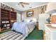 Spacious bedroom with a large bed, built-in shelves, and nautical theme at 5171 Deeson Pointe Ct, Lakeland, FL 33805
