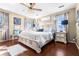 Main bedroom with large bed, nightstands, and light wood furniture at 5171 Deeson Pointe Ct, Lakeland, FL 33805