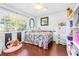 Charming bedroom with floral bedding and ample closet space at 5171 Deeson Pointe Ct, Lakeland, FL 33805