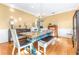 Farmhouse dining room with a large wooden table and chandelier at 5171 Deeson Pointe Ct, Lakeland, FL 33805