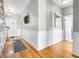 Hardwood floors and white wainscoting in a spacious entryway at 5171 Deeson Pointe Ct, Lakeland, FL 33805
