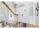Bright entryway with hardwood floors, staircase, and double doors at 5171 Deeson Pointe Ct, Lakeland, FL 33805