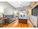 Gathering room with hardwood floors, a sofa, and access to the backyard at 5171 Deeson Pointe Ct, Lakeland, FL 33805