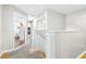 Upstairs hallway with white railings and carpeted floors at 5171 Deeson Pointe Ct, Lakeland, FL 33805