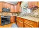 Kitchen features granite countertops and stainless steel appliances at 5171 Deeson Pointe Ct, Lakeland, FL 33805