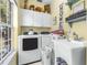 Laundry room with washer, dryer, utility sink, and cabinets at 5171 Deeson Pointe Ct, Lakeland, FL 33805