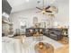 Living area features vaulted ceiling, spiral staircase, and leather furniture at 5171 Deeson Pointe Ct, Lakeland, FL 33805