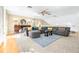 Large living area with sectional sofa and lots of natural light at 5171 Deeson Pointe Ct, Lakeland, FL 33805