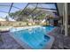 Inviting screened pool with spacious deck at 5171 Deeson Pointe Ct, Lakeland, FL 33805