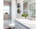 Clean bathroom with a bathtub, toilet and a single sink vanity at 555 Silver Course Run, Ocala, FL 34472