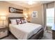 Bedroom with wood flooring and a large window at 555 Silver Course Run, Ocala, FL 34472
