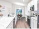 Spacious kitchen with stainless steel appliances and granite countertops at 555 Silver Course Run, Ocala, FL 34472