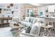Living room with light-colored sofa and two armchairs at 555 Silver Course Run, Ocala, FL 34472