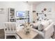 Living room with light-colored sofa and two armchairs at 555 Silver Course Run, Ocala, FL 34472